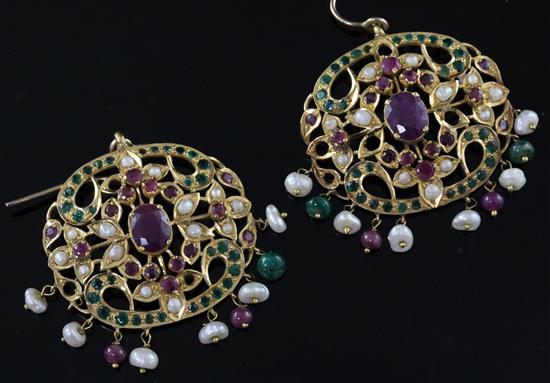 An ornate pair of Indian pierced gold, ruby, emerald and baroque pearl set drop earrings, 41mm.